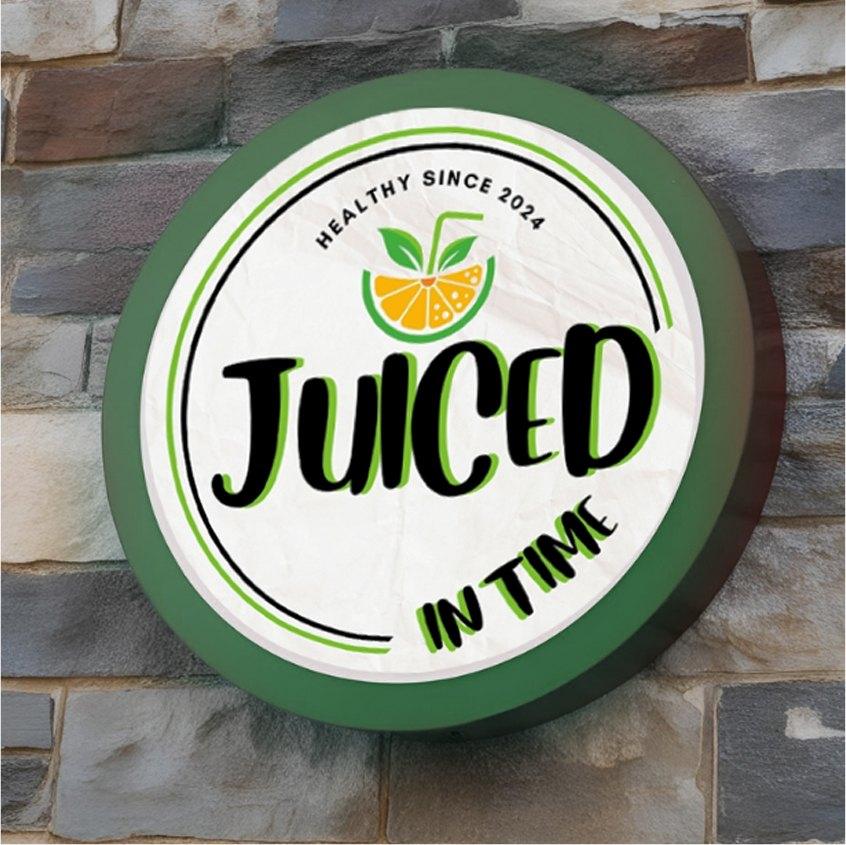 Round illuminated storefront sign on a stone wall