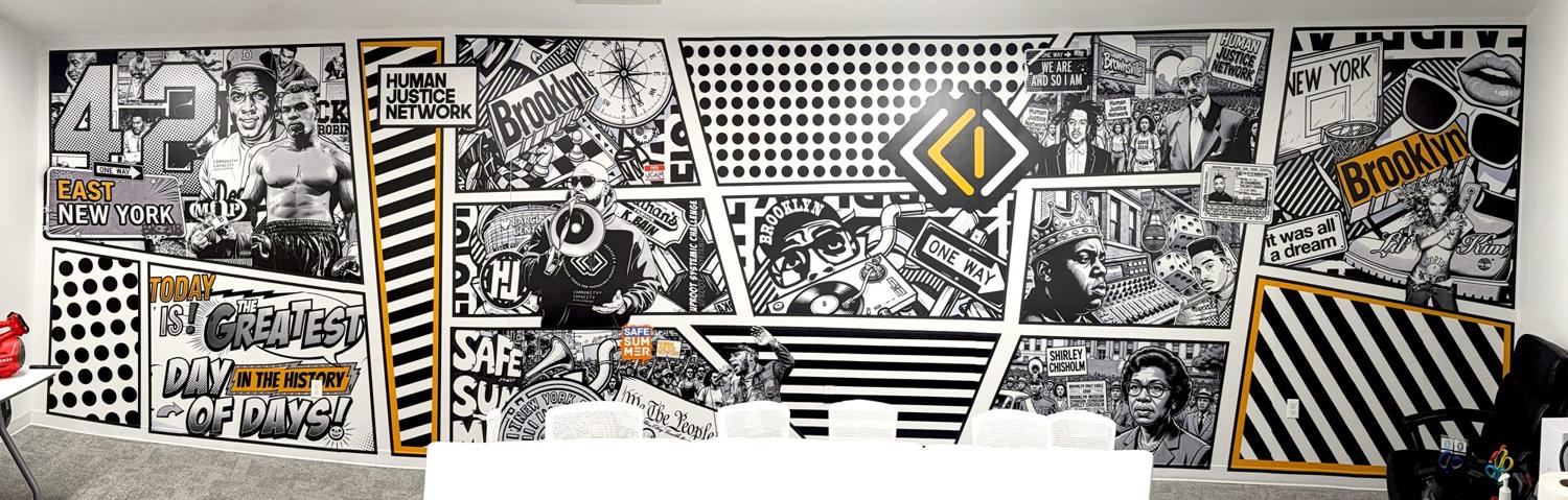 Black-and-white comic-style Brooklyn history wall in an office