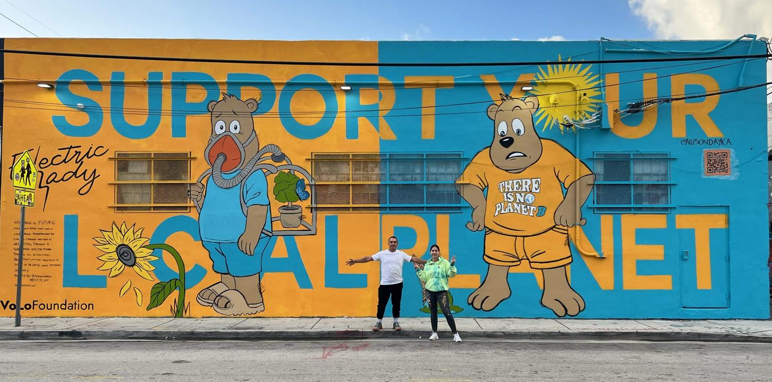 Outdoor Support Your Local Planet mural with two cartoon bears