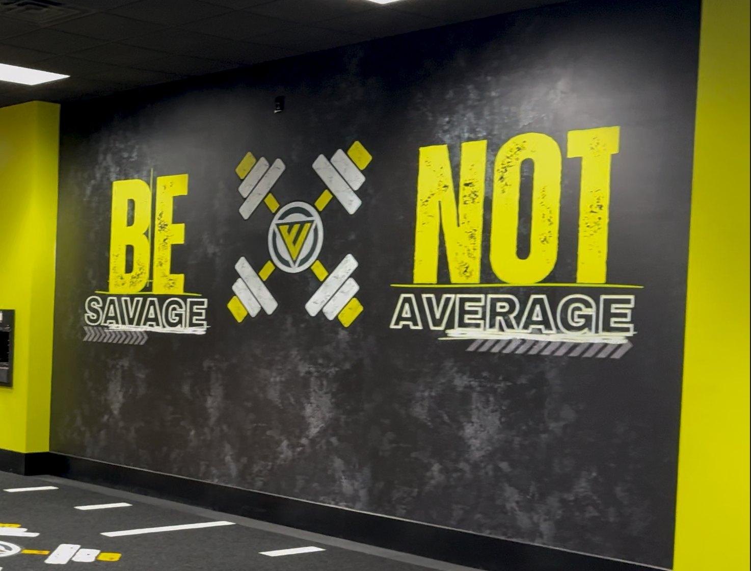 Be Savage Not Average printed gym wall in black and yellow