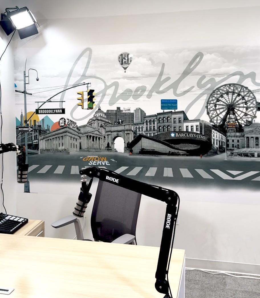 Black-and-white Brooklyn skyline wall in a podcast studio