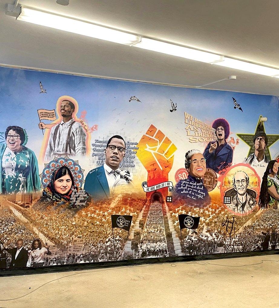 Finished civil rights history mural in a community hall